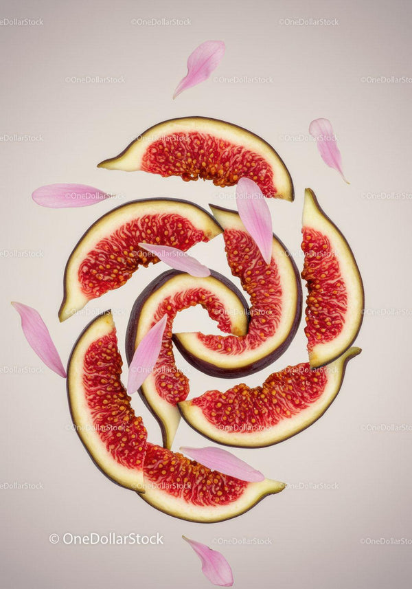 Fresh Fig Slices Arranged with Pink Flower Petals