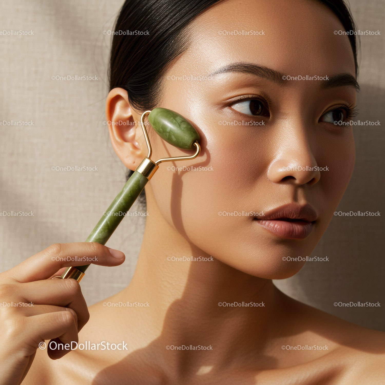 Young Woman Using Jade Roller for Facial Skincare