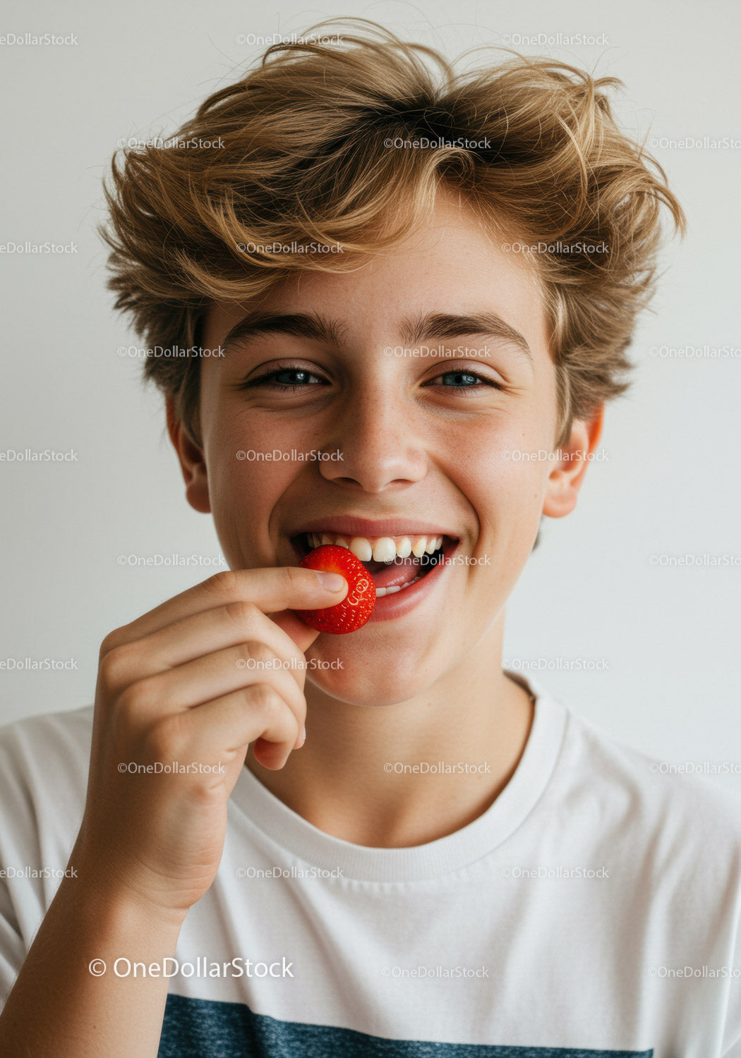 Joyful Boy Enjoying Fresh Strawberries in Bright Summer Scene