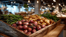 Fresh Vegetables in a Rustic Market Display with Red Onions and Potatoes