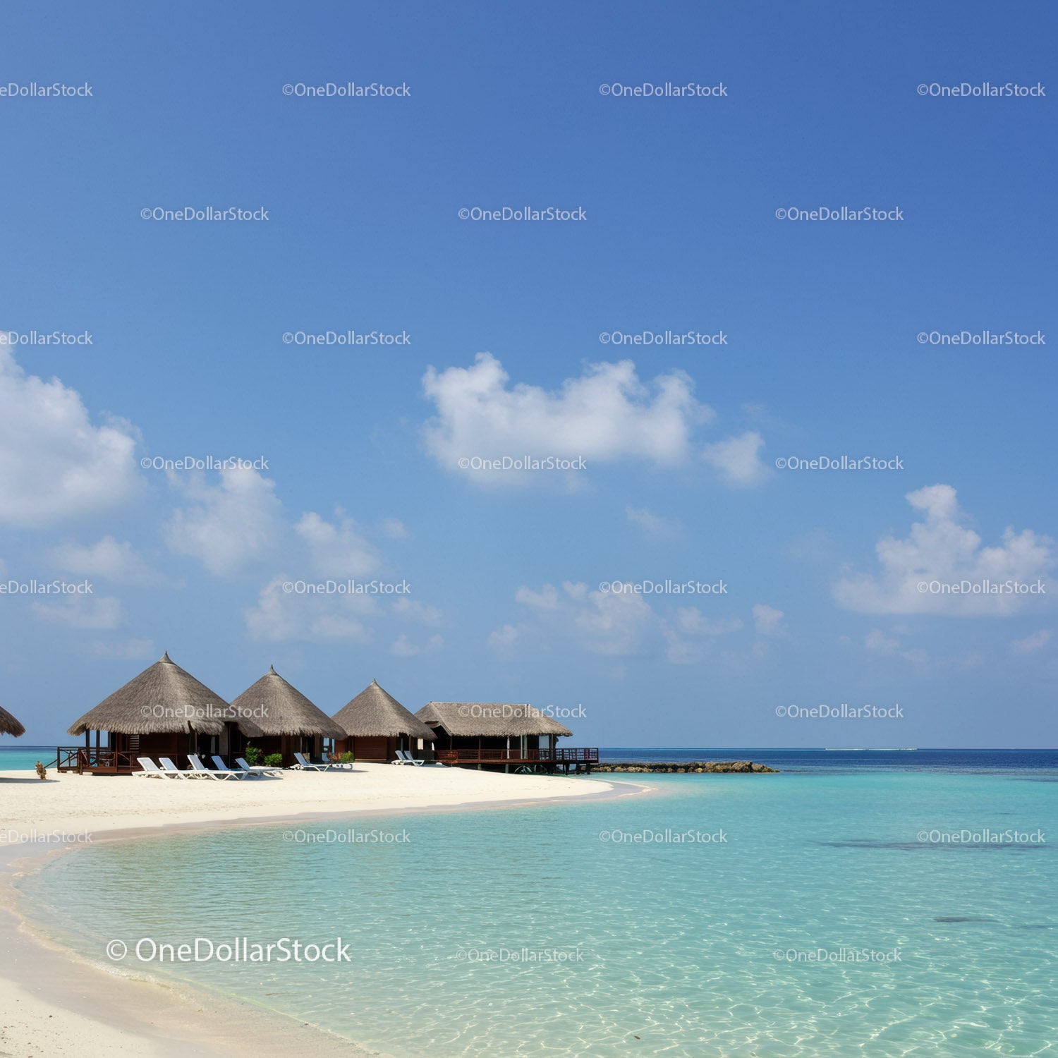Tropical Beach with Overwater Bavilions and Clear Turquoise Water