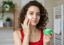 Young Woman Applying Face Cream for Skincare Routine with Natural Beauty Vibe