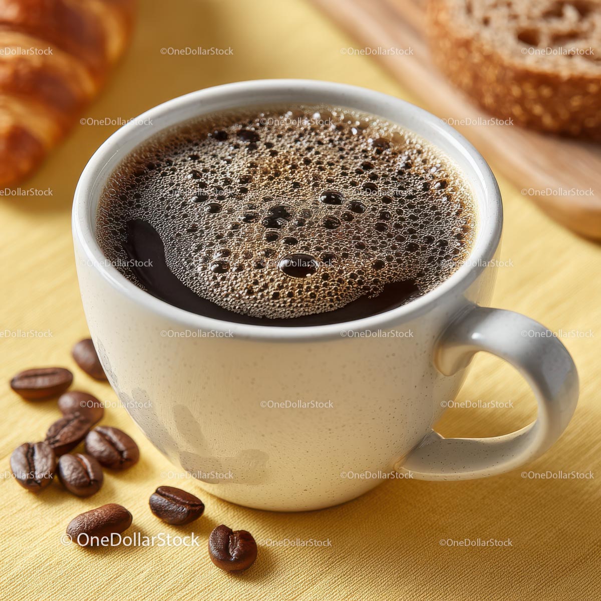 Delicious Brewed Coffee in White Cup with Breakfast Goodies