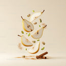 Sliced Pears with Pistachios and Cinnamon Sticks Floating