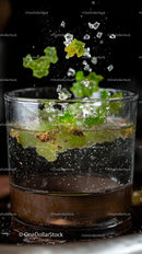 Colorful Candy Gummy Bears Flying Into Glass of Water