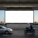Urban street with blank billboard and moving traffic