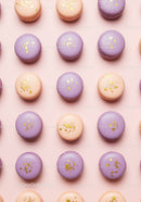 Pastel purple and beige macarons with gold flakes
