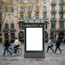 Urban street scene with blank advertising board and pedestrians
