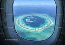 Aerial View of a Tropical Island in Blue Ocean with White Sand Beaches