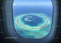 Aerial View of a Tropical Island in Blue Ocean with White Sand Beaches