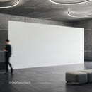 Modern gallery interior with blank white wall and sofa