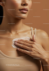 Close-Up of Woman Applying Moisturizer to Face in Skincare Routine