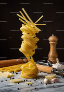 Uncooked Tagliatelle Pasta with Garlic and Cheese on Marble