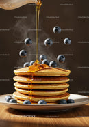 Stack of golden pancakes with dripping syrup and blueberries