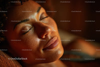 Close-Up of Beautiful Woman with Glowing Skin and Calm Expression