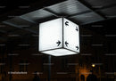 Illuminated directional cube sign at urban night scene