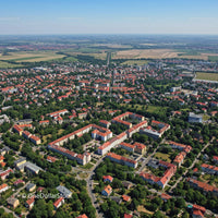 Aerial View of Suburban Neighborhood with Red Roofs and Green Parks