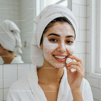 Smiling woman enjoying facial skincare routine at home
