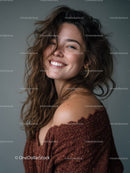 Joyful Woman with Wavy Hair Wearing Brown Sweater in Studio