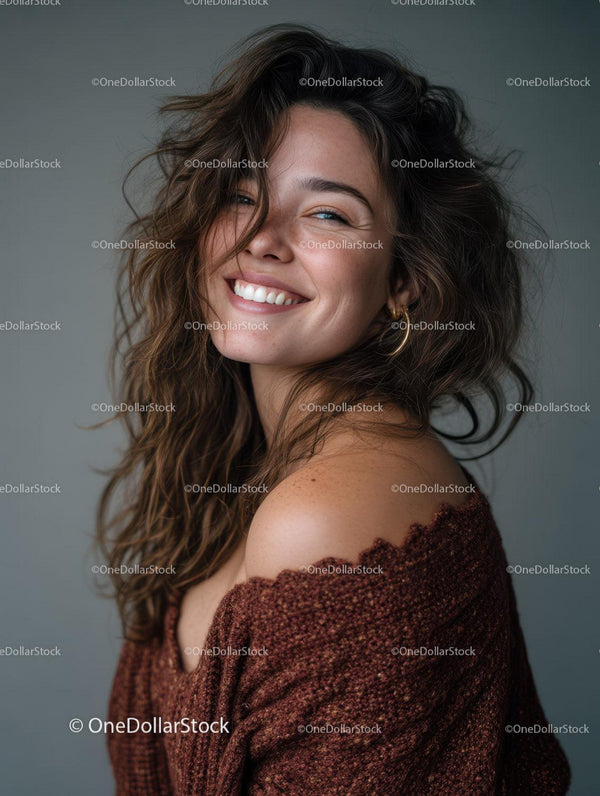 Joyful Woman with Wavy Hair Wearing Brown Sweater in Studio