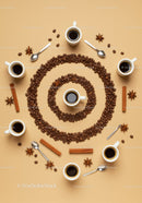 Top view of black coffee cups with coffee beans spiral