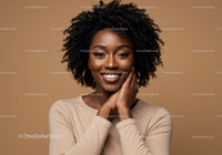 Portrait of a Cheerful Black Woman with Curly Hair and Hoop Earrings