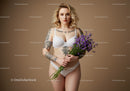 Beautiful Tattooed Woman in White Lingerie Holding Purple Flowers with Beige Background