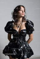 Fashion Model in Black Glossy PVC Dress with Layered Jewelry