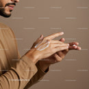Close-up of a Man Applying Moisturizer on Hands in Self-Care Routine