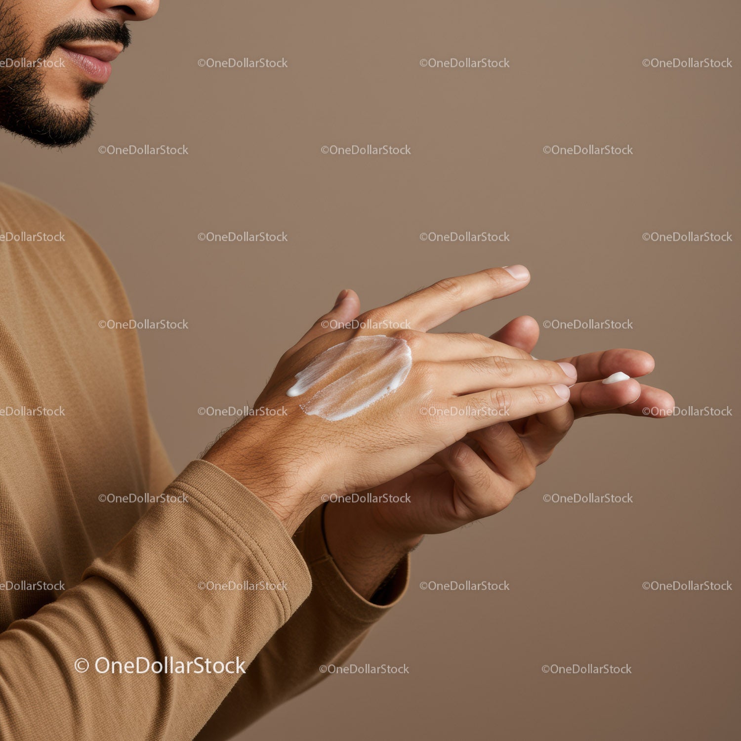 Close-up of a Man Applying Moisturizer on Hands in Self-Care Routine