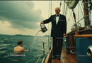 Elegant Man in Tuxedo Watering Young Man in Pool on Boat Deck