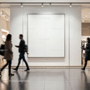 People walking past blank gallery wall in modern mall