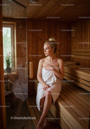 Relaxing Woman in Sauna with Wooden Interior and Towel in Cozy Atmosphere