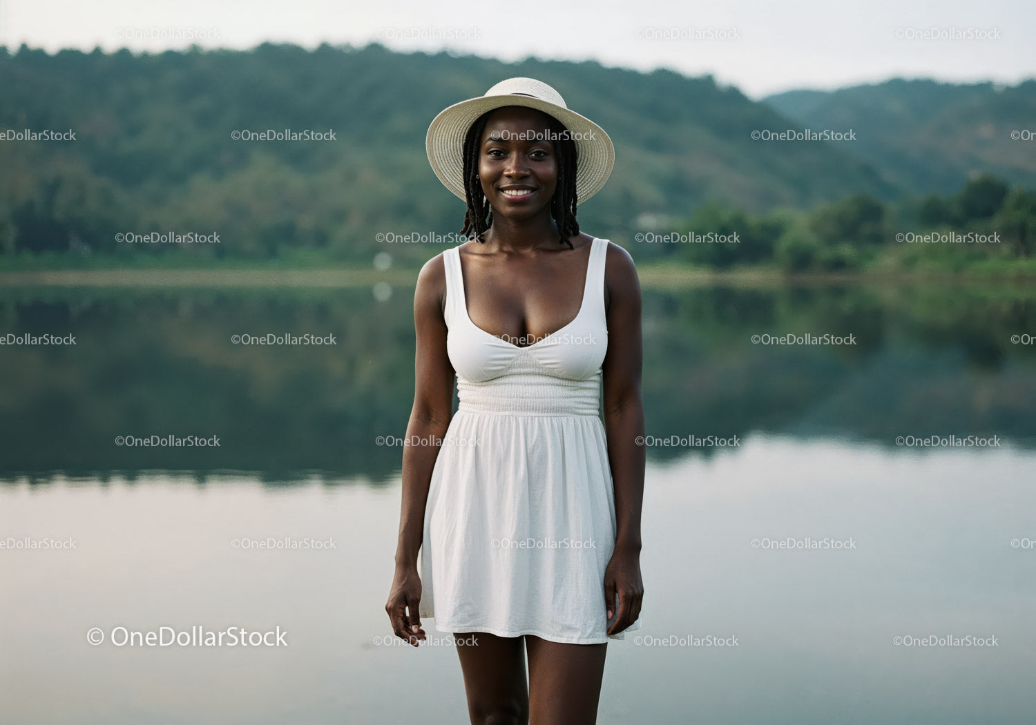 Beautiful Woman in White Dress with Wide-Brim Hat by Lake
