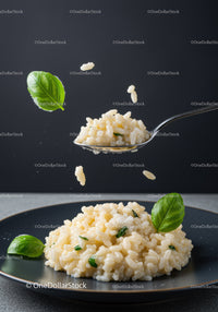 Creamy risotto garnished with fresh basil leaves