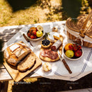 Rustic Picnic Setting with Fresh Bread and Cheese