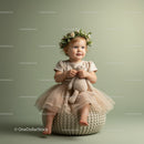 Toddler girl with flower crown holding soft toy