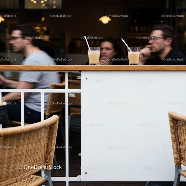 Two glasses with drinks in cozy café setting JPG Mockup Image