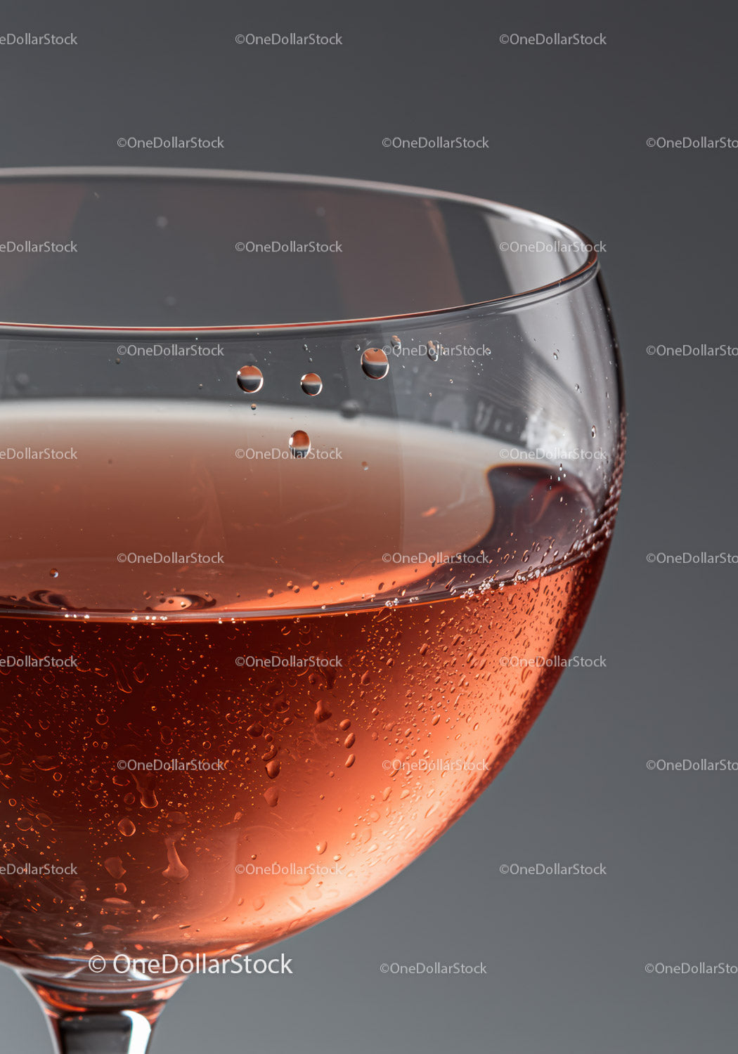 Close up of rose wine glass with condensation drops
