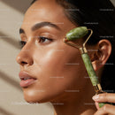 Woman Using Jade Roller for Facial Skin Rejuvenation and Relaxation