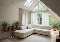 Bright modern living room with corner sofa and plants