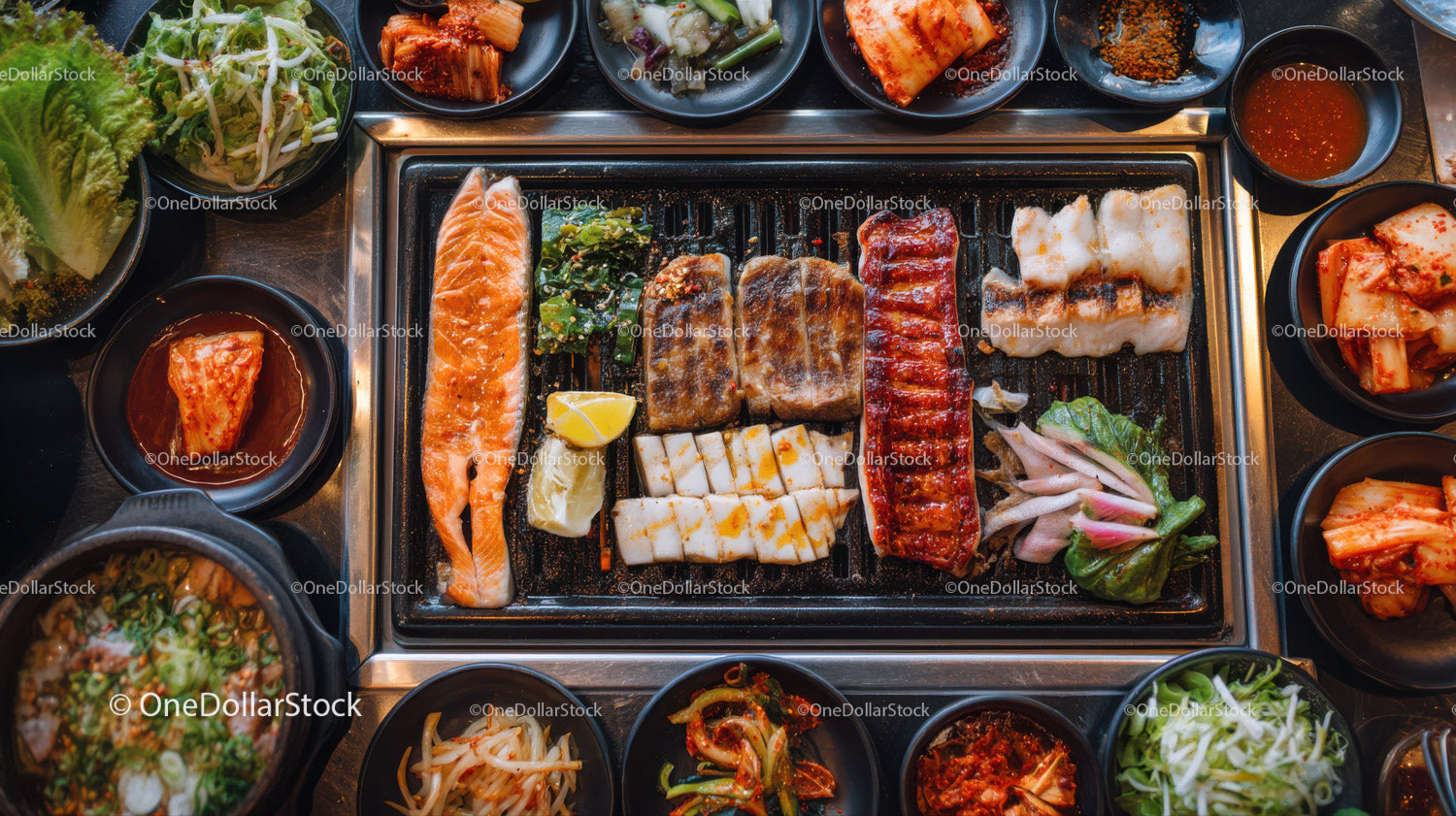Korean barbecue with assorted meats and vibrant side dishes