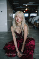 Stylish Young Woman in Velvet Dress and Silver Jewelry in Urban Setting