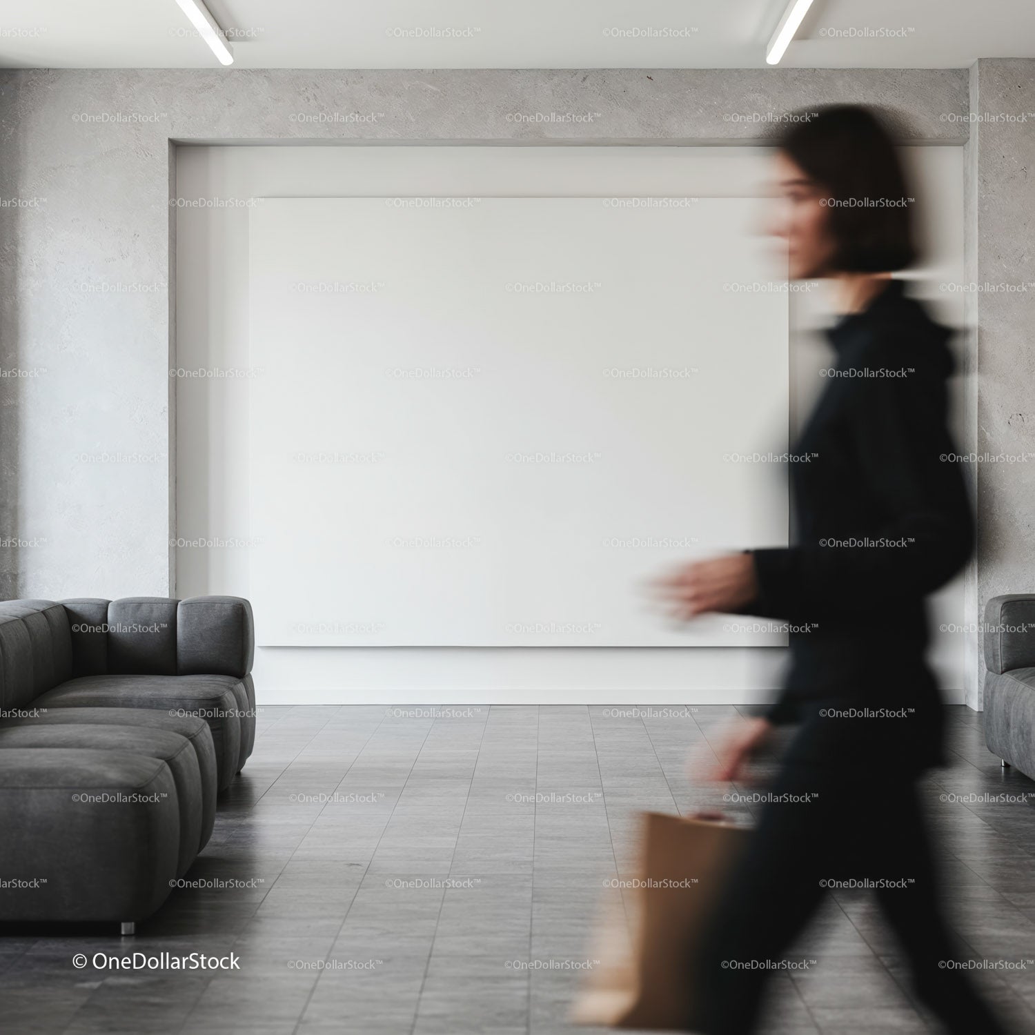 Blurred woman walking through modern minimalist lobby