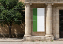 Green and white banner hanging between classical columns