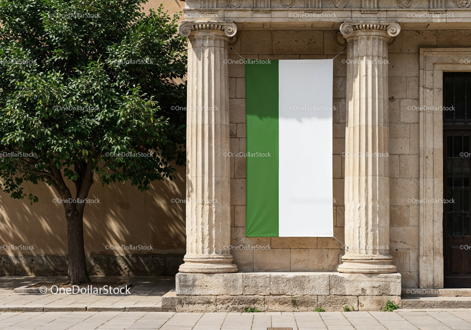 Green and white banner hanging between classical columns
