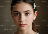Close-Up Portrait of a Young Woman with Pearl Hair Clip and Hazel Eyes