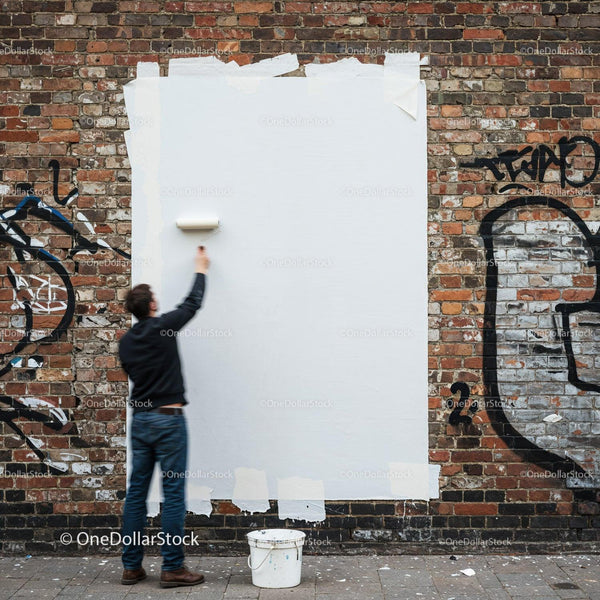 Man Painting Over Graffiti on Urban Brick Wall JPG Mockup Image