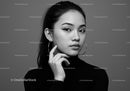 Elegant Black and White Portrait of a Woman with Hoop Earrings