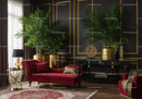 Elegant living room with red chaise lounge and greenery